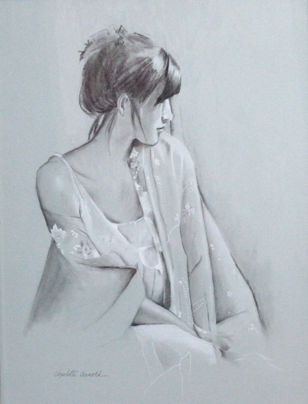 A charcoal figure drawing by Charlotte Arnold on light grey toned paper. The figure is a seated woman with her hair in a bun and loose, flowing clothing draped to expose one shoulder. Her head is turned to her left with a calm expression.